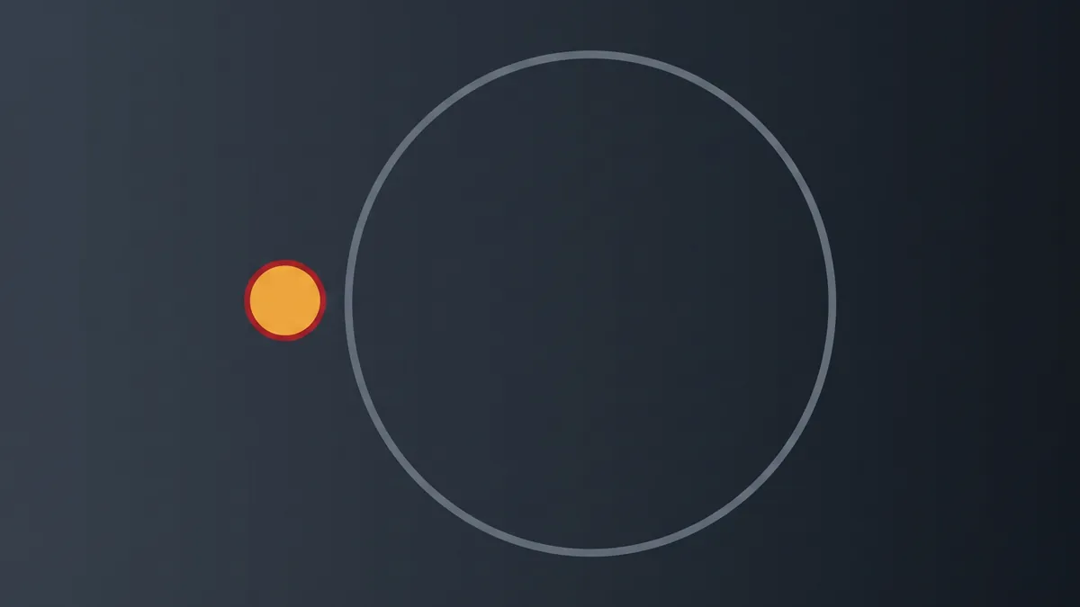 One very small amber disc beside the outline of a far larger circle