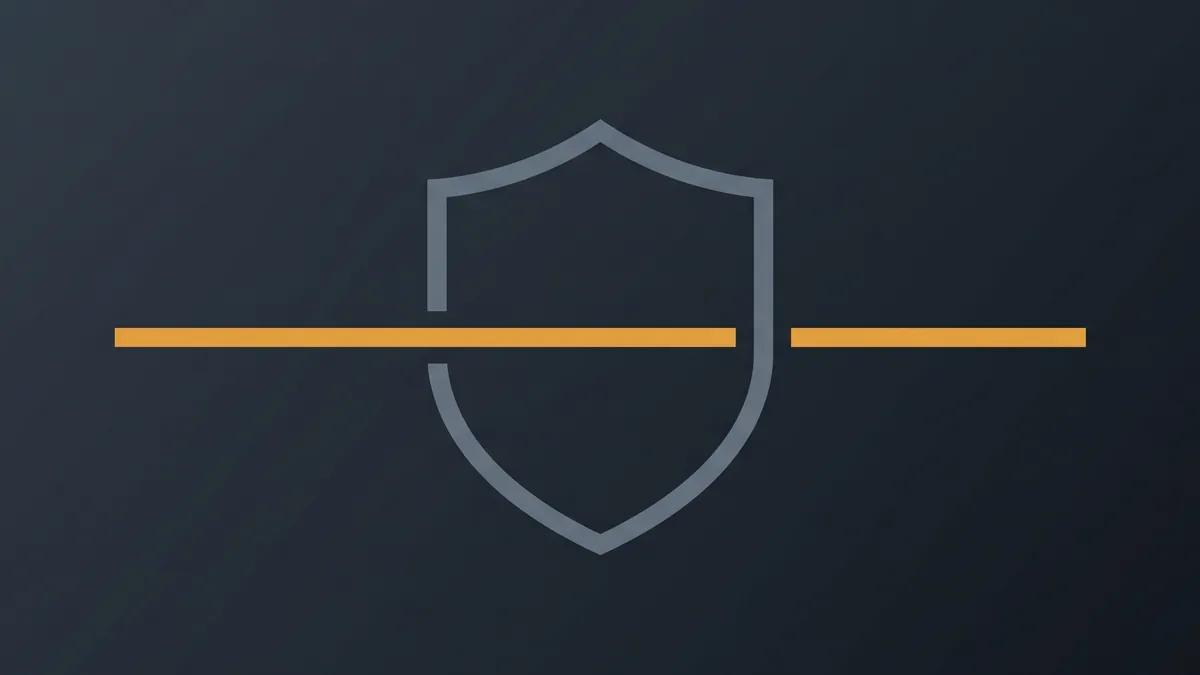 A steel grey shield outline with an amber line running straight through it and out of frame on both sides
